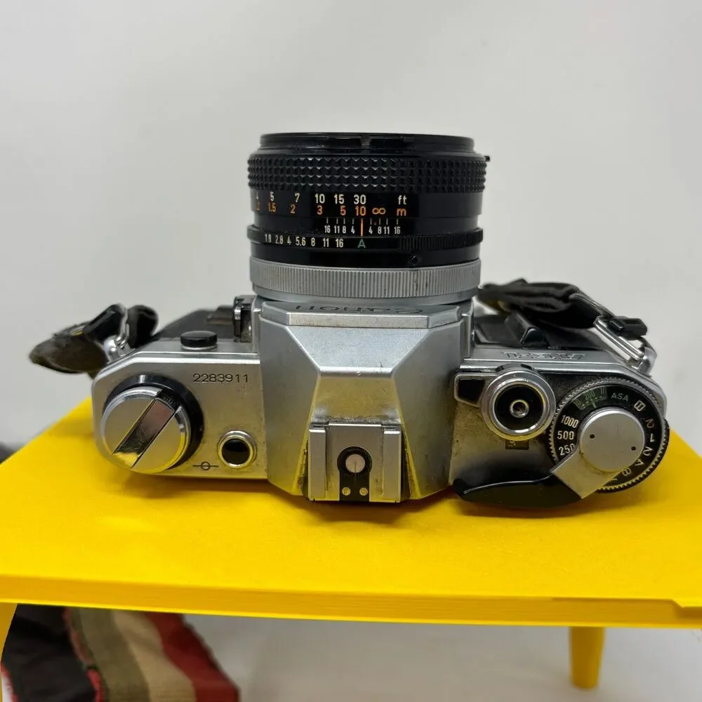 Canon AE-1 35mm SLR Film Camera W/ 2 Lens, Flash, Case, Paperwork UNTESTED